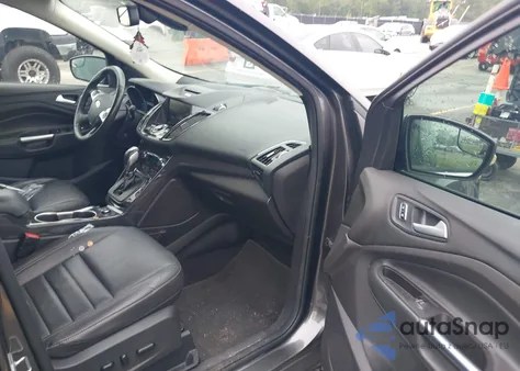 2015 Ford Escape Titanium z USA, uszkodzony, nr VIN 1FMCU0JX9FUC31859